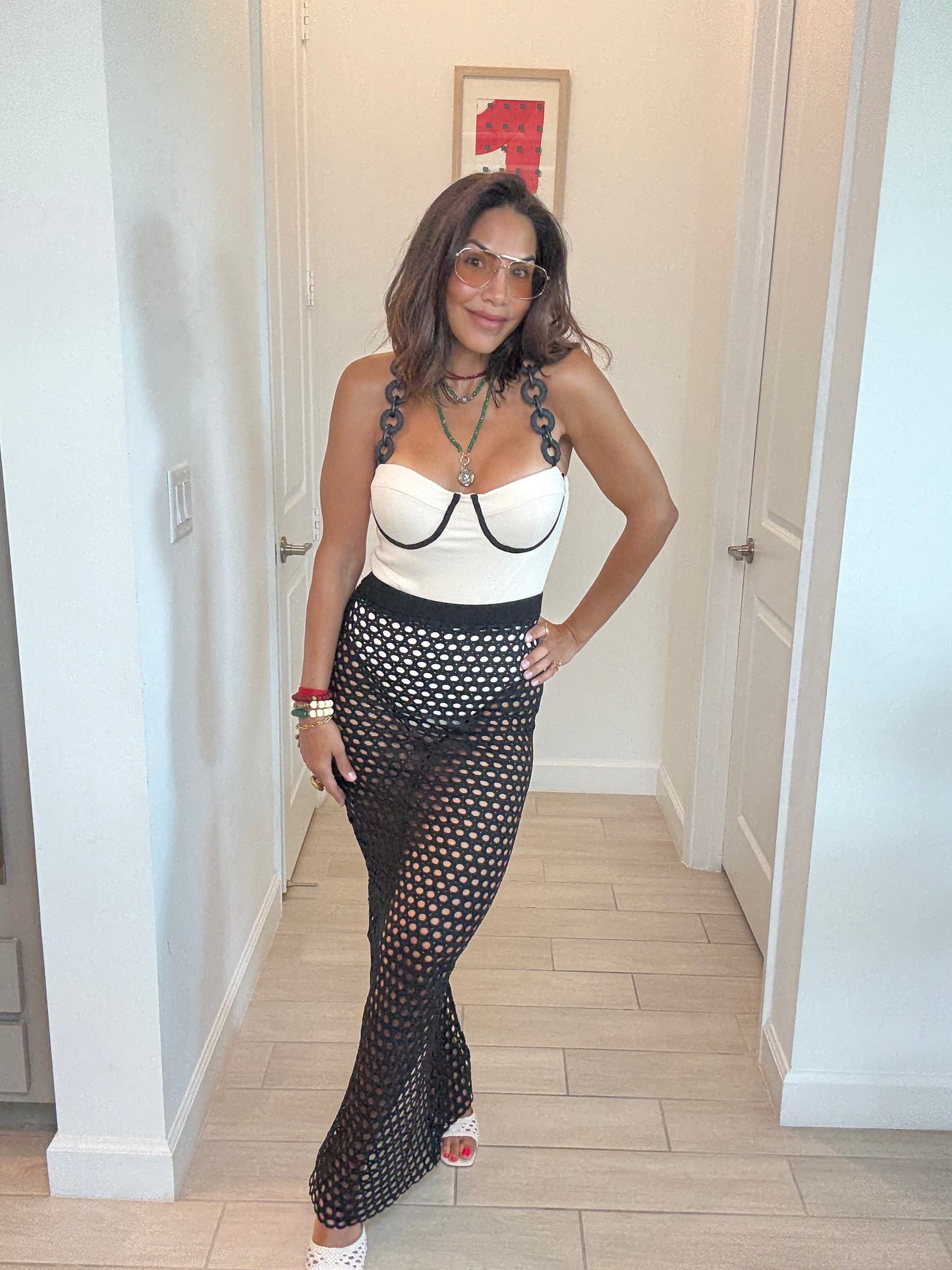 Chic Cream Bodysuit & Black Fishnet Skirt Set