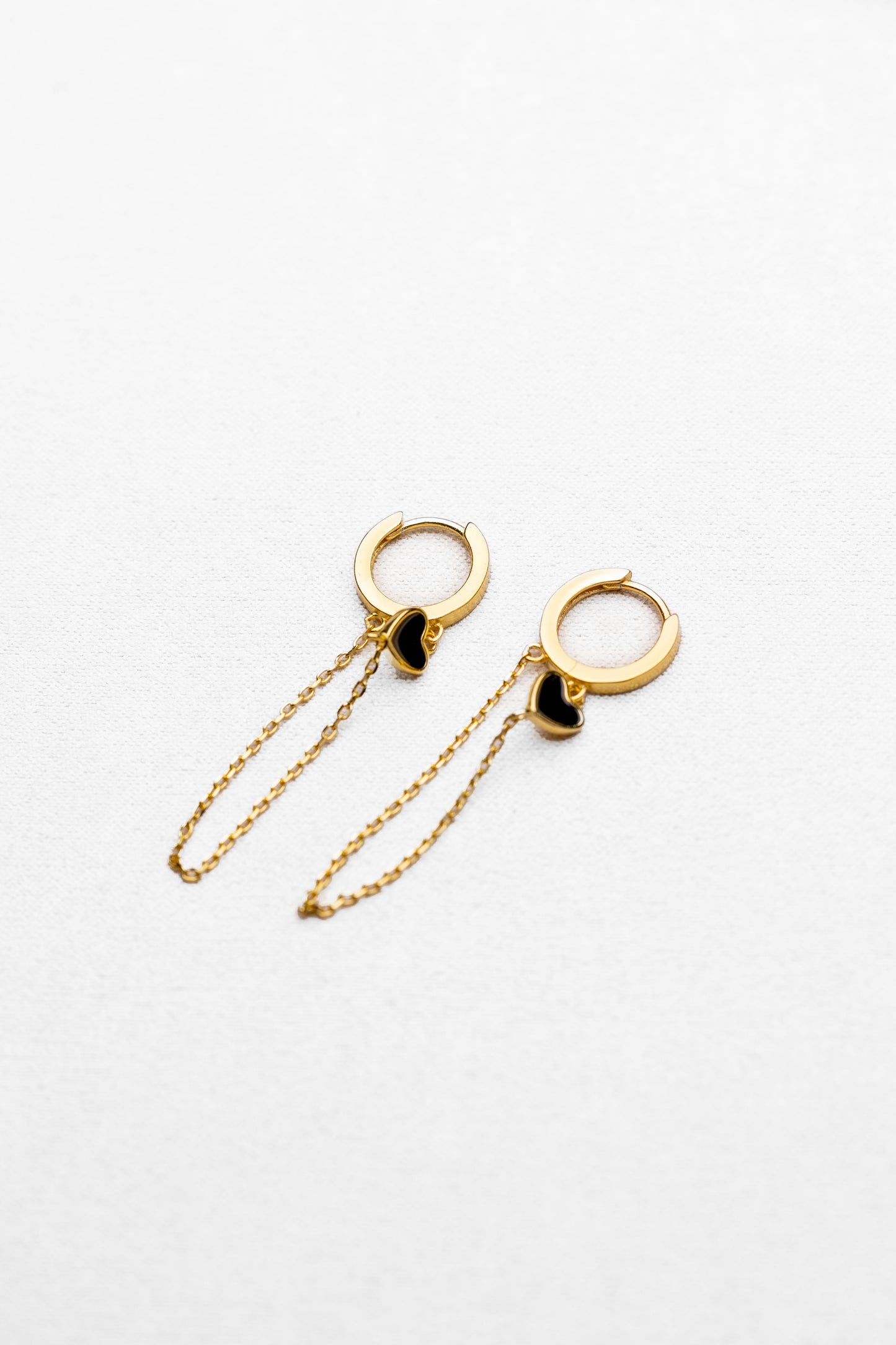 Golden Huggie Hoop Earrings with Black Heart and Double Chain Dangle